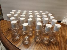 clear 2oz round bottles w/ disc top dispensing lid