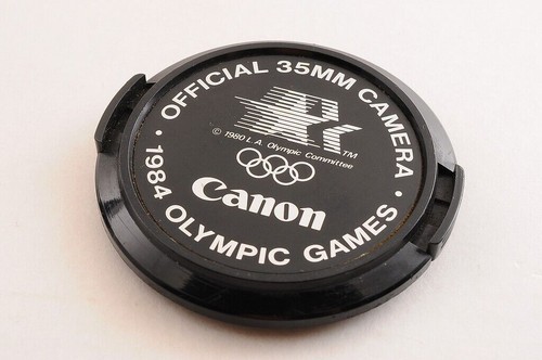 【CASI COMO NUEVO+】CANON NEW FD NFD 24mm F/2.8 MF Lens Cap + 1984 OLYMPIC... - Imagen 11 de 12