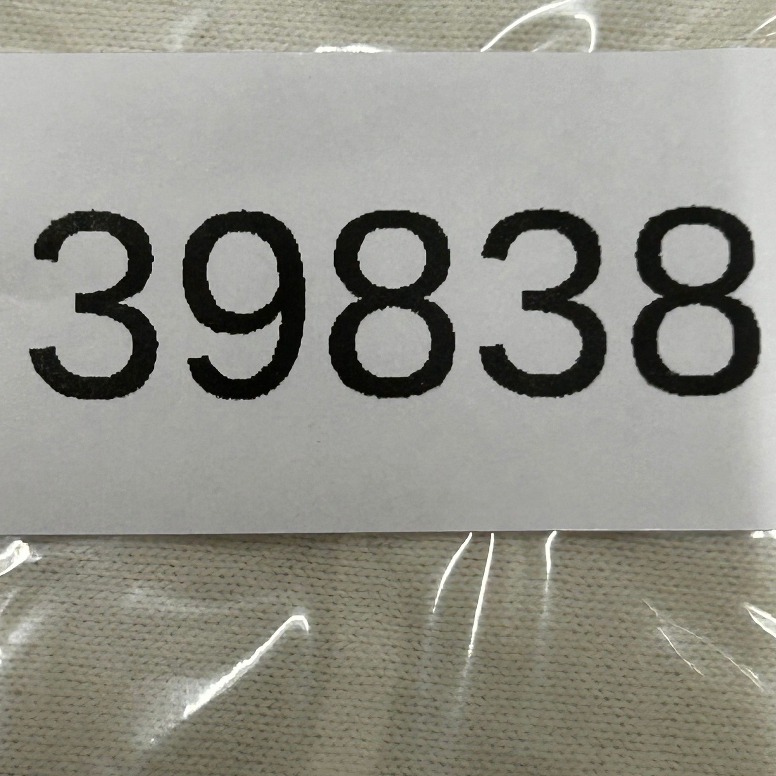 Cream Fruit of the Loom men’s XXL T-shirt with black “39838” label and white bridges of Madison County USA text.