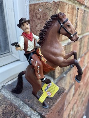 cowboy on horseback figurine by Plastoy