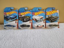 Hot Wheels Muscle Mania Lot Of 4 Car Camaro Iroc-Mustang GT-Mustang Coupe-Camaro