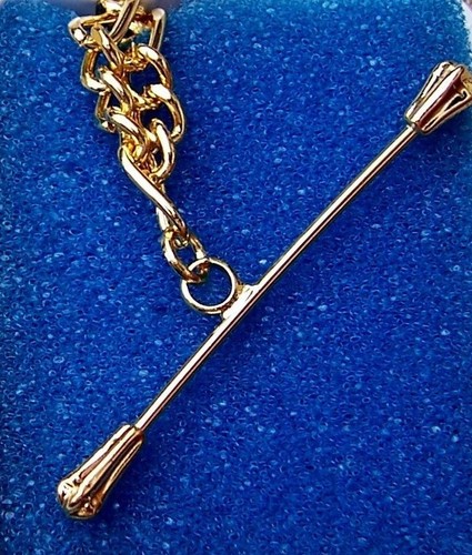 baton twirling gold bracelet, 1.