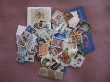 Stamps, 100 world mixed.No repeats. Paper backs off. Canada,Hungary,USA etc.Used