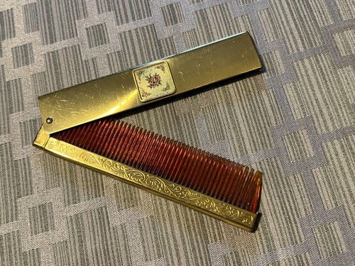 Vintage compact folding pocket comb with engraved gold-tone metal case floral
