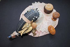 VINTAGE COLLECTION OF SEWING PIN CUSHION, SEWING BIRD AND CARVED COQUILLA NUTS