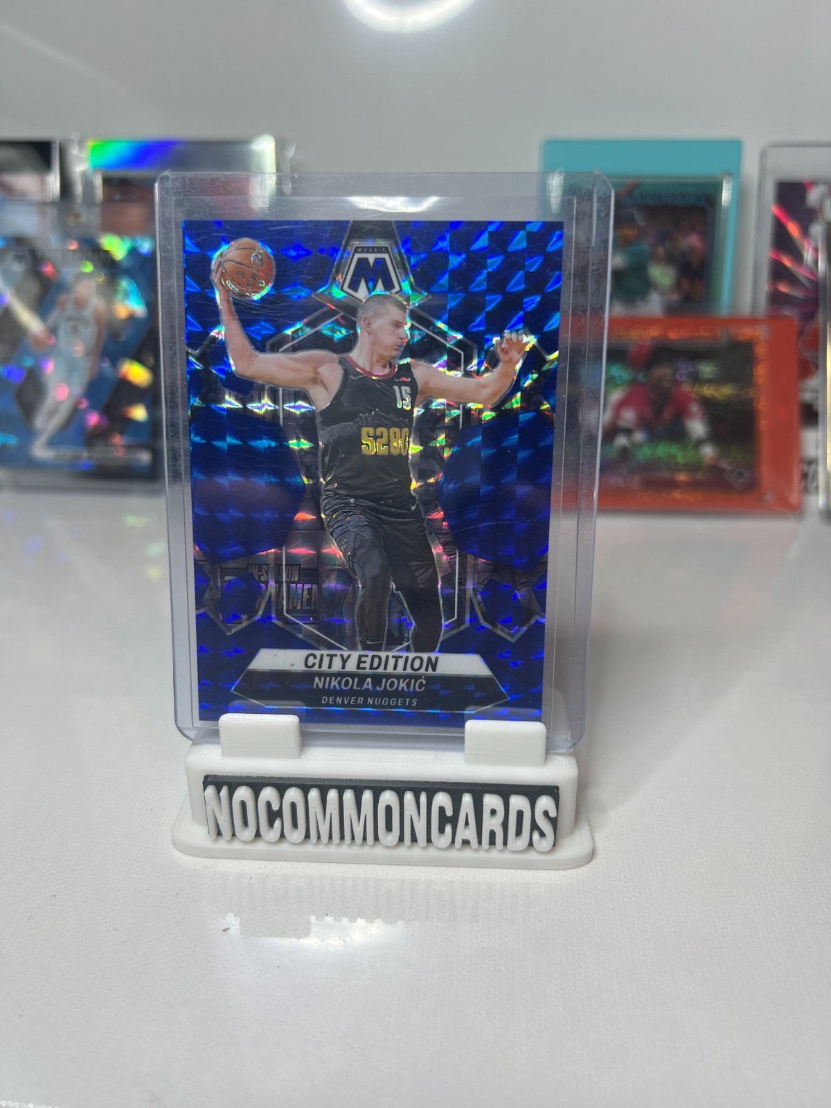 2023 Panini Mosaic #287 Nikola Jokic City Edition Blue Mosaic /199