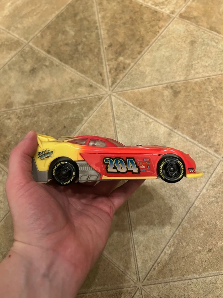 Hasbro NASCAR Racers "Charger" Mark McCutchen 204 figure + car - Image 2 of 4