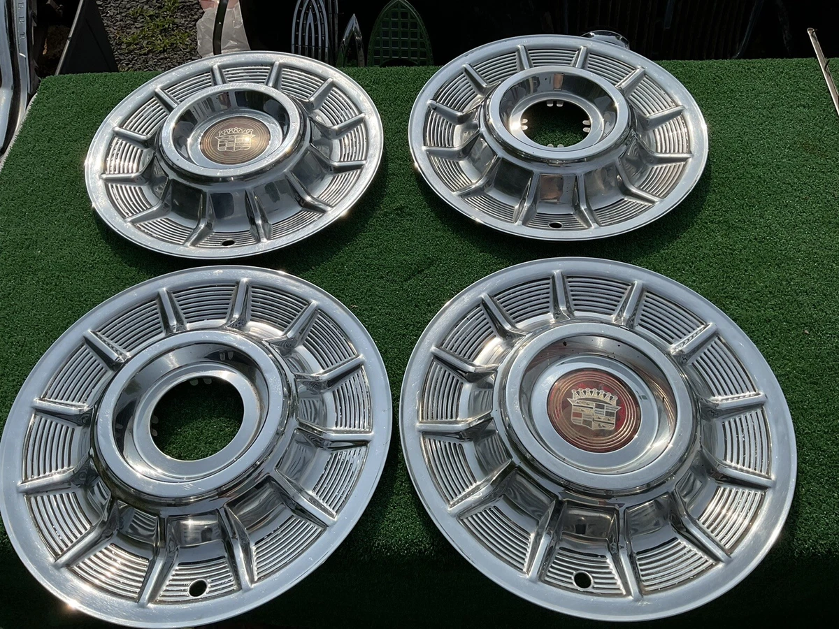 1957 Cadillac hubcaps Nice eBay