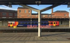 PHOTO  A SINGLE-CARRIAGE TRAIN DRAWING INTO DERBY STATION SEEN FROM PLATFORM 6A