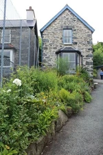 Photo 6x4 Weavers Cottage and garden, Trefriw Woollen Mills Llanrwst All  c2017