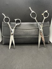 Paul Mitchell set of two shears, with leather case. A condition