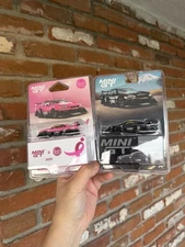 DiecastTalk X MiniGT Give 1/64 Nissan LB-ER34 Pink Mini GT Diecast And Black