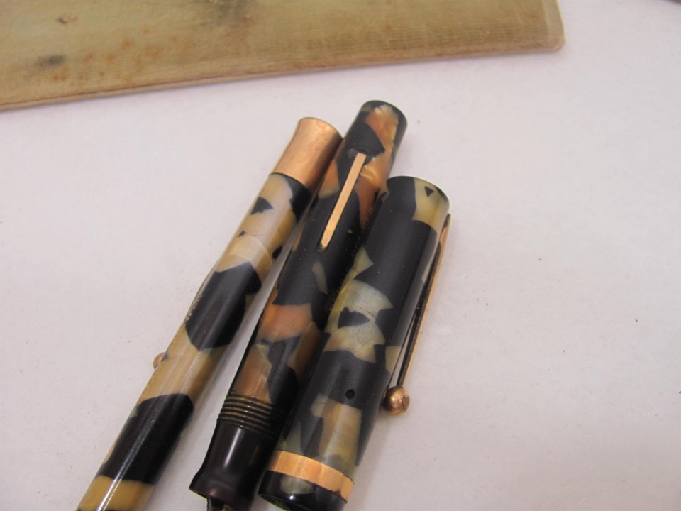 A vintage Sheaffer fountain pen, in black with gilt mounts and 14ct