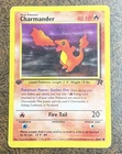 Charmander 50/82 1st Edition Team Rocket Common Pokémon Card.