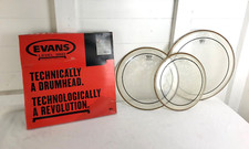 Three Used Remo Drums Heads in Evans Box. 12", 13" and 16"