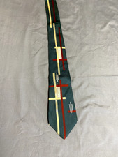 Vintage Wembley men's tie, green with reds, yellows, whites architectural design