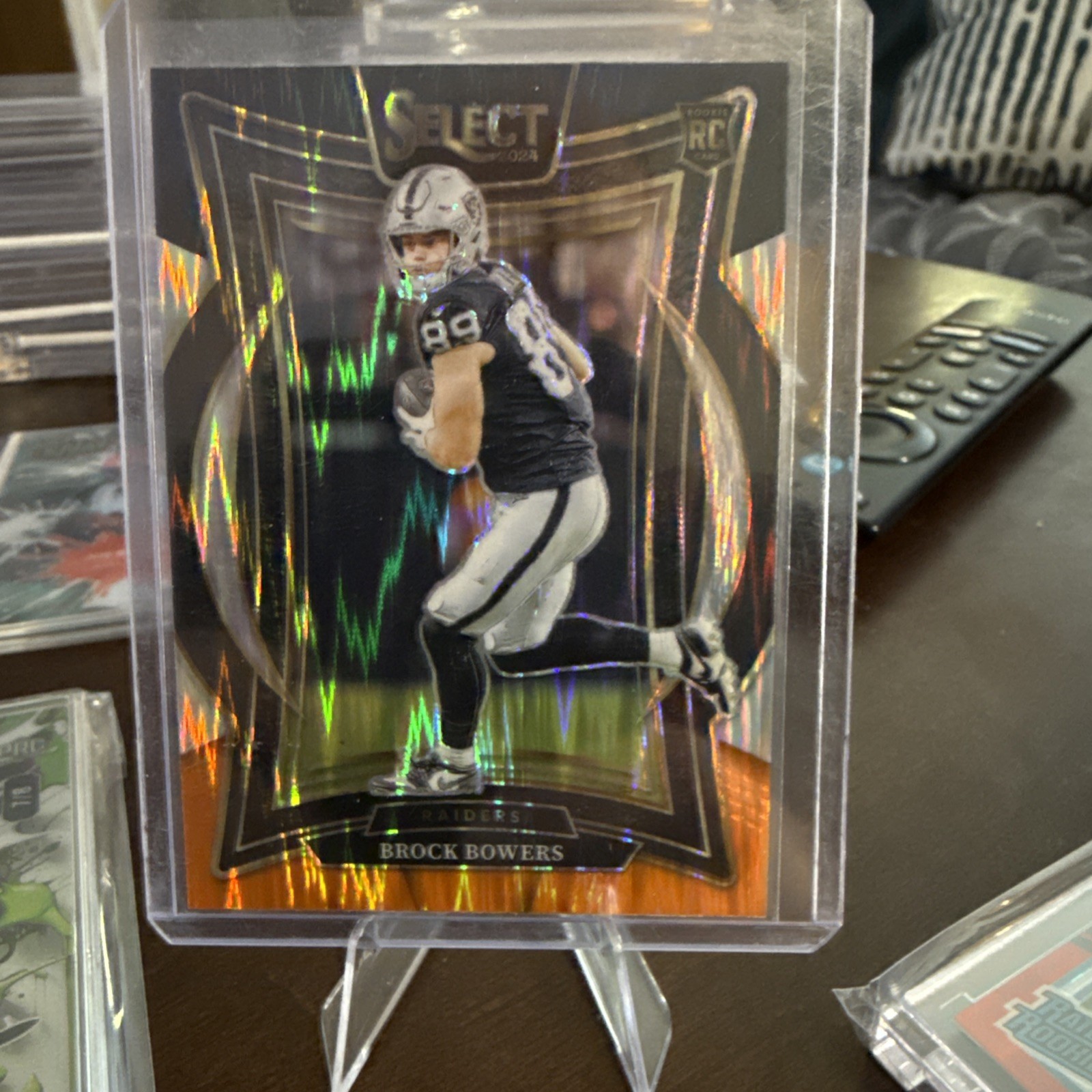 2024 Panini Select - Concourse Brock Bowers #31 Black & Orange Shock Prizm (RC)