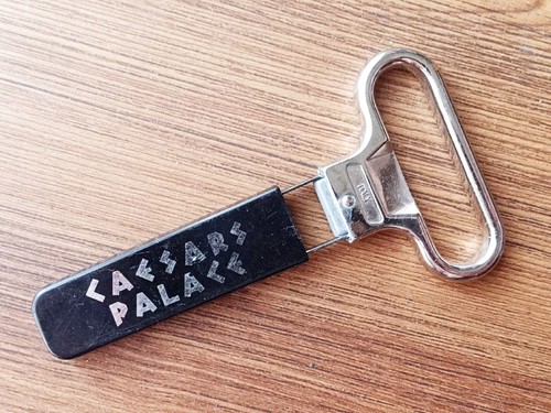 VTG TWO-PRONG CORK PULLER in BLACK PLASTIC COVER w/AD "CAESARS PALACE". Italy.
