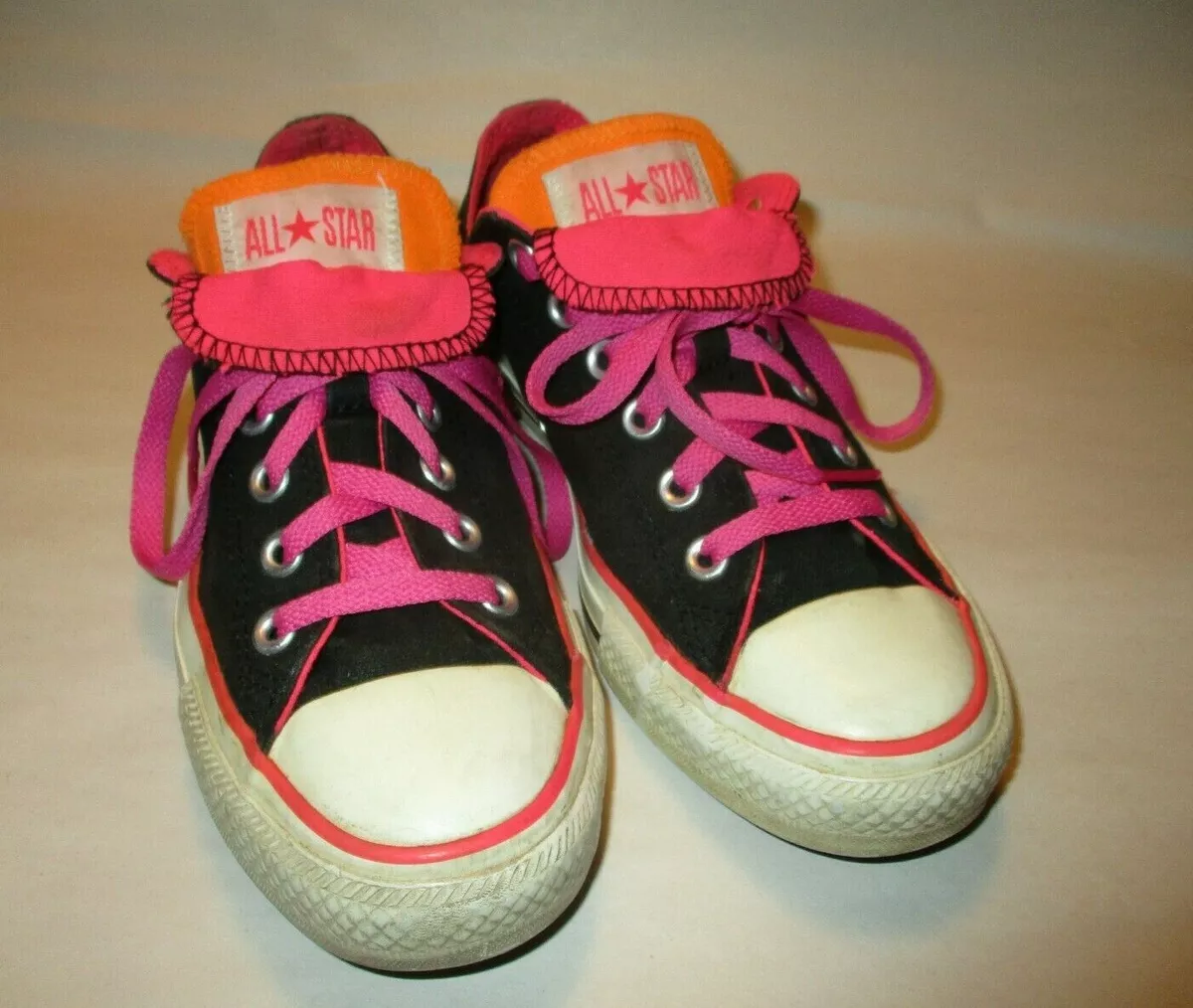 Black and pink double tongue converse top