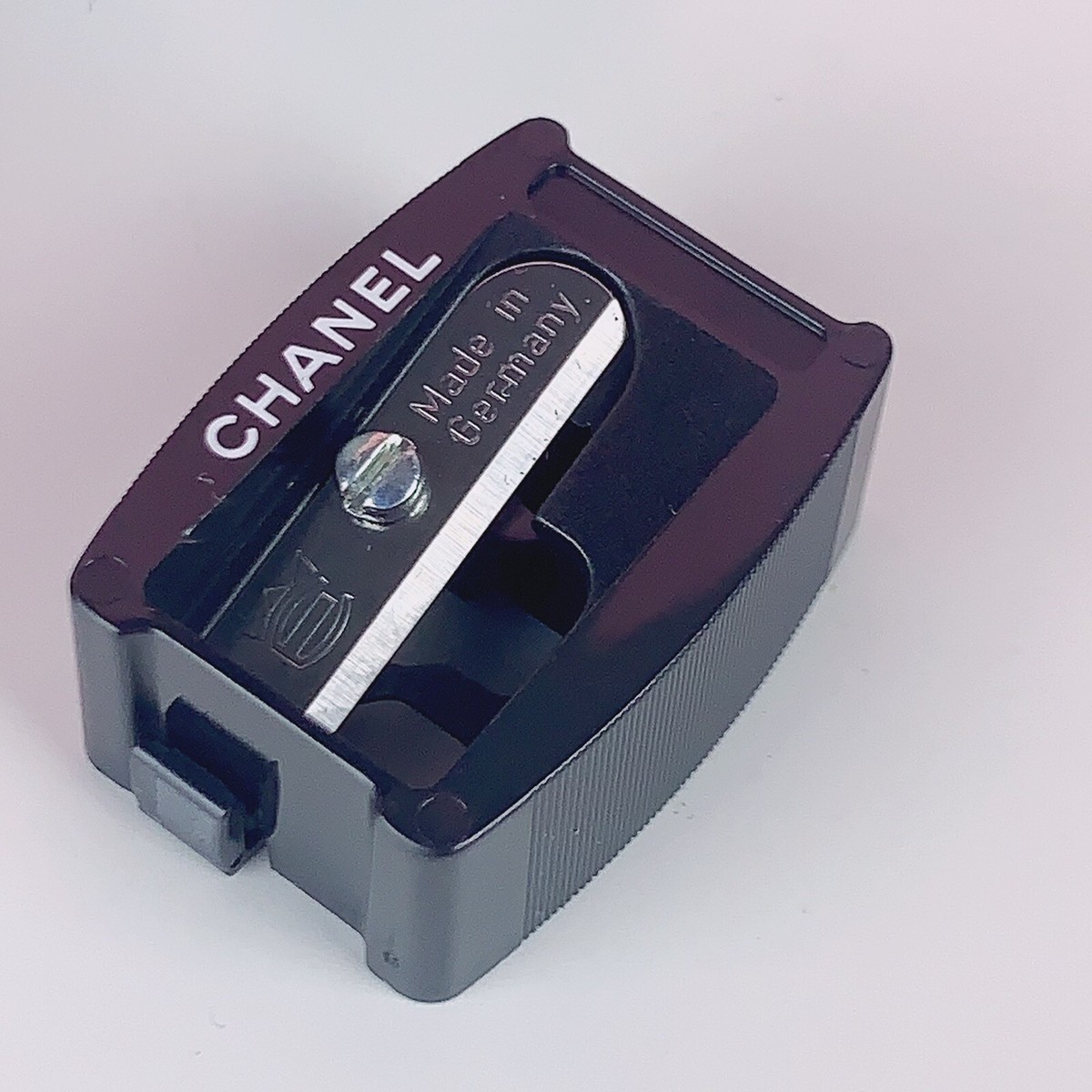 1) Chanel Black Plastic Makeup Pencil Sharpener made in Germany