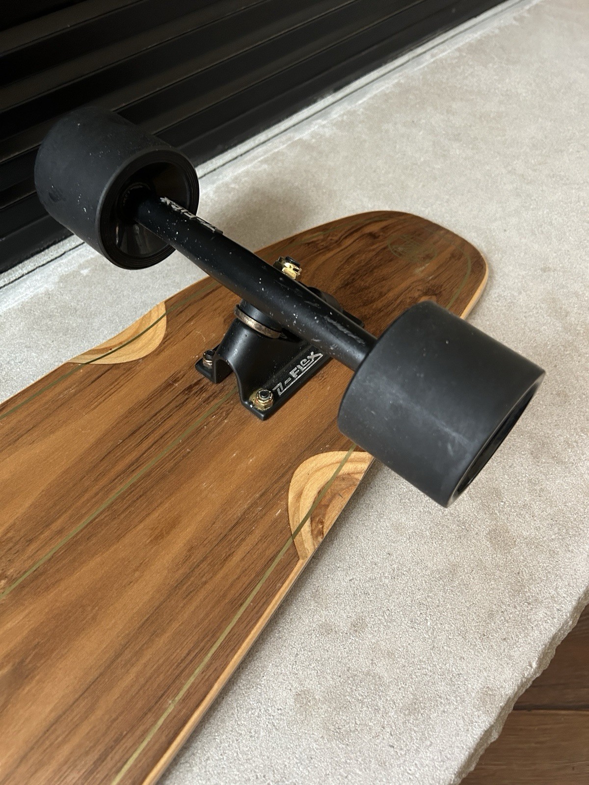 Z-Flex Ruins to Roses Roundtail longboard.