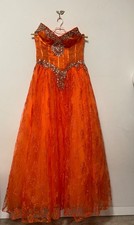 Orange evening length maxi dress made of lace sparkling stones