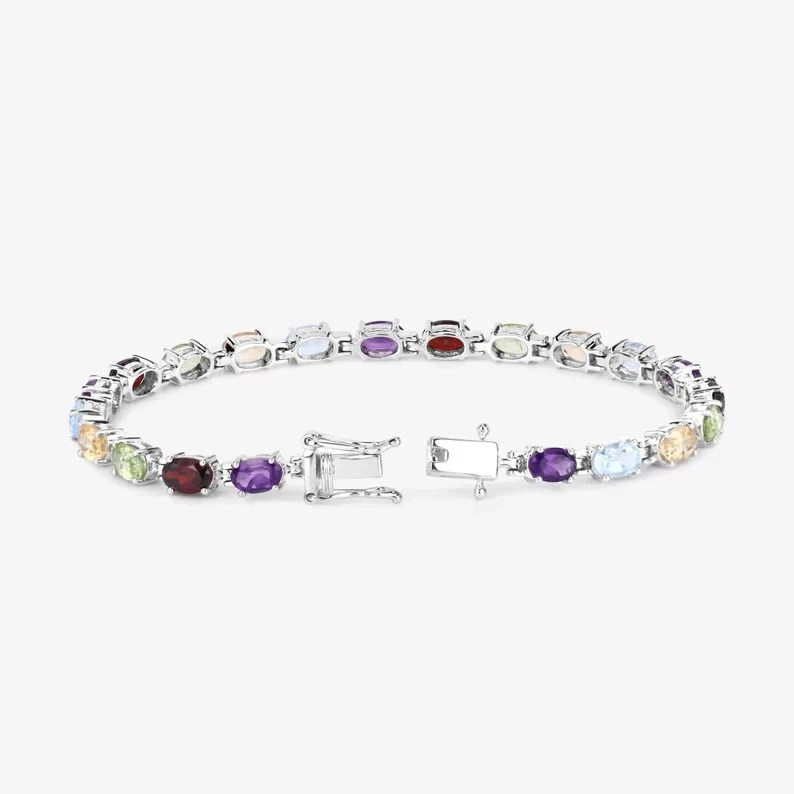 Brazalete tenis peridoto multicolor creado en laboratorio ovalado de 10 quilates enchapado en oro blanco de 14 quilates Foto 4 de 4