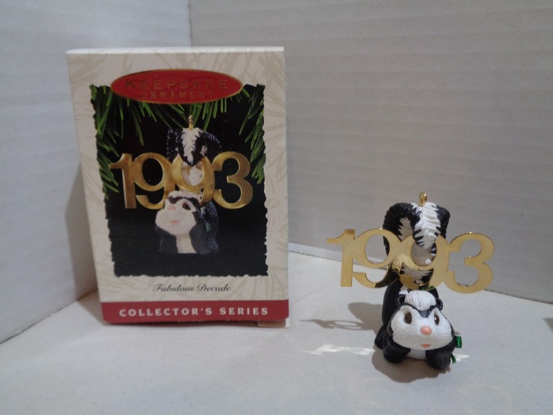 2 Hallmark keepsake ornaments - 1991 snowy owl & 1993 Skunk - really cute