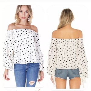 white polka dot off the shoulder top