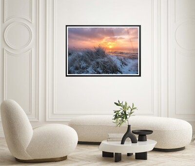 A Sunset Over the Ocean with Snow on The Ground Premium Quality Poster