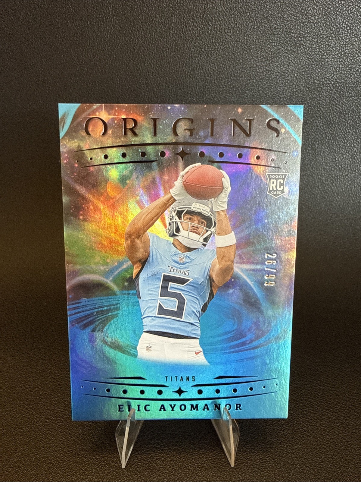 2025 Panini Origins - Rookies Elic Ayomanor, Elic Ayomanor #108 Blue /99 (RC)