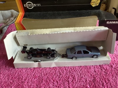 Gama vauxhall cavalier saloon with trailer and lotus sports car on rare blue