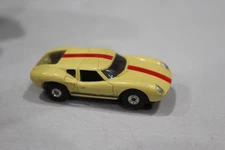 Vintage Aurora Slot Car HO Cigar Box Lola GT Yellow With Red Stripe