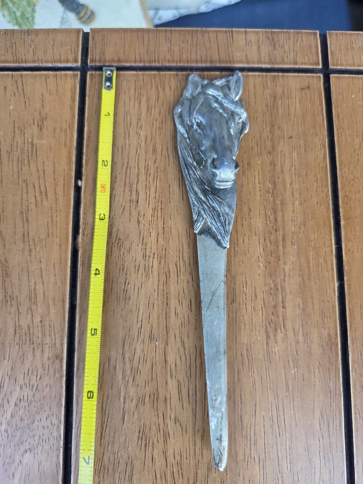 A 1982 Wilton pewter horse-head letter opener is the kind of desk object that stops visitors mid-sentence — functional sculpture for the equestrian-obsessed.