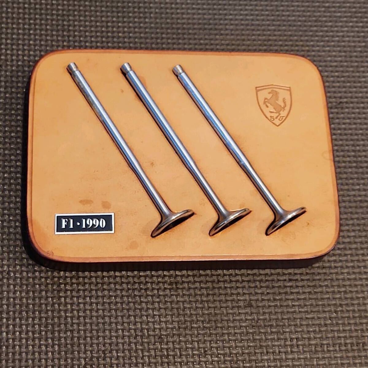 Genuine Ferrari 641/2 F1 Engine Valves on Schedoni Layered Genuine Ferrari 641/2 F1 Engine Valves on Schedoni Layered