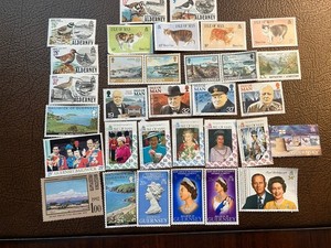 32 MINT HINGED STAMPS FROM THE CHANEL ISLANDS