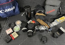 Vintage Lot Canon AE-1 35mm SLR Film Camera w Lens Filters Teleplus Adapt Bags