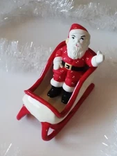Vintage Santa Claus figurine and sleigh. Separate pieces