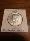 Add it to your collection 1967 Kennedy Half Dollar off center strike coin