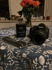 Nikon D D5100 16.2MP Digital SLR Camera - Black (Kit with VR 18-55 mm Lens)