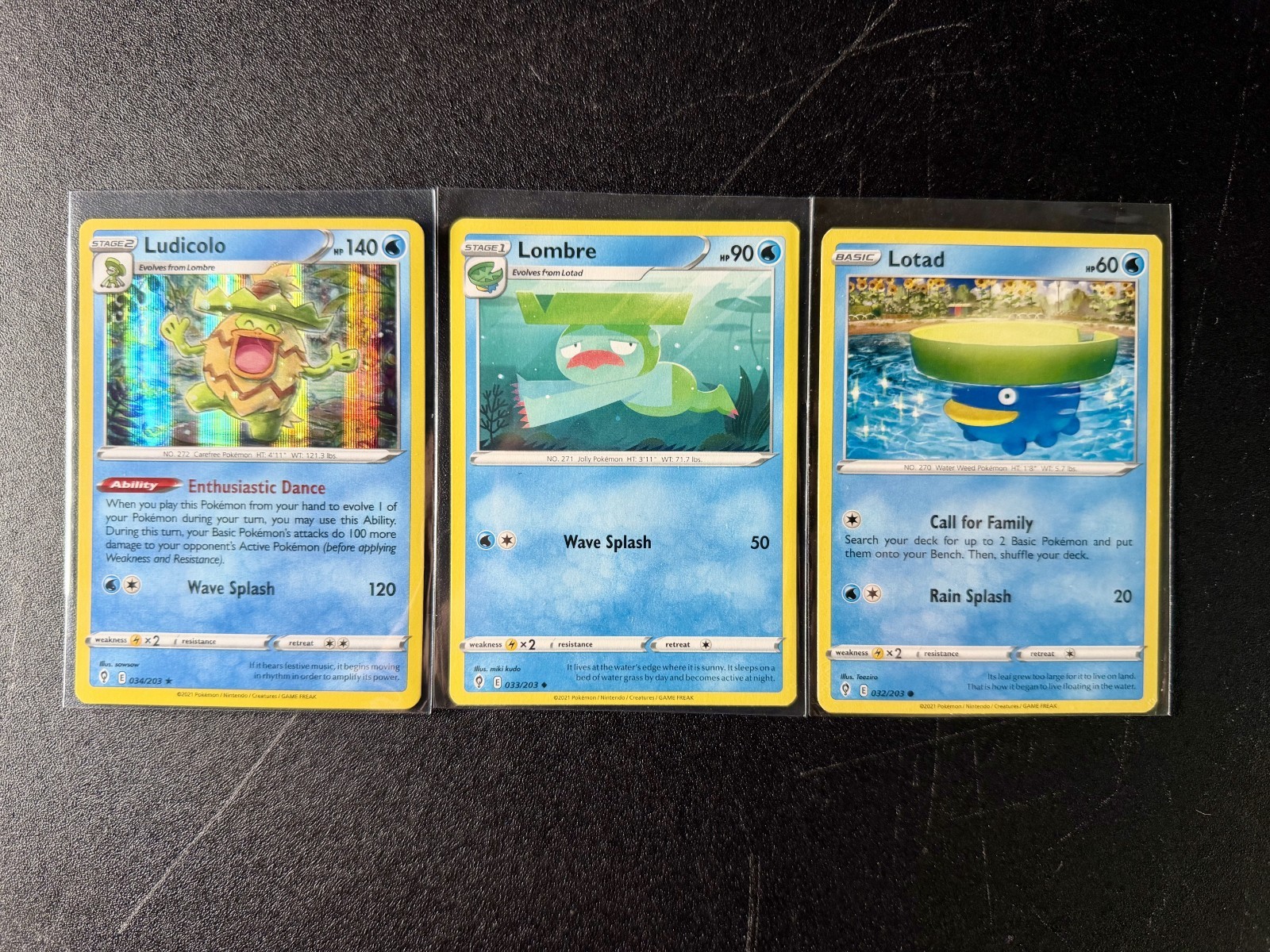 3 POKEMON LUDICOLO 34/203 LOMBRE 33/203 LOTAD 32/203 EVOLVING SKIES