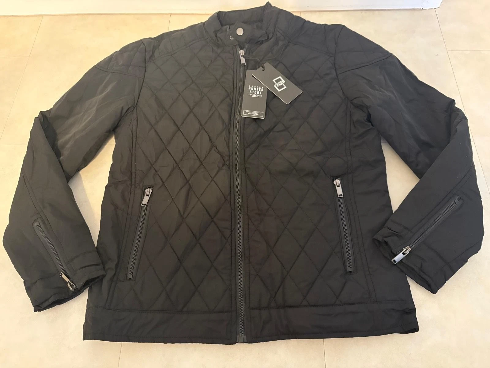 Mens, medium, black quilted jacket (new and never worn)