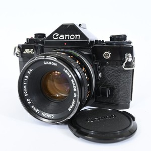 Canon A-1 + FD 1,8/50mm + Power Winder A en superbe état Single lens