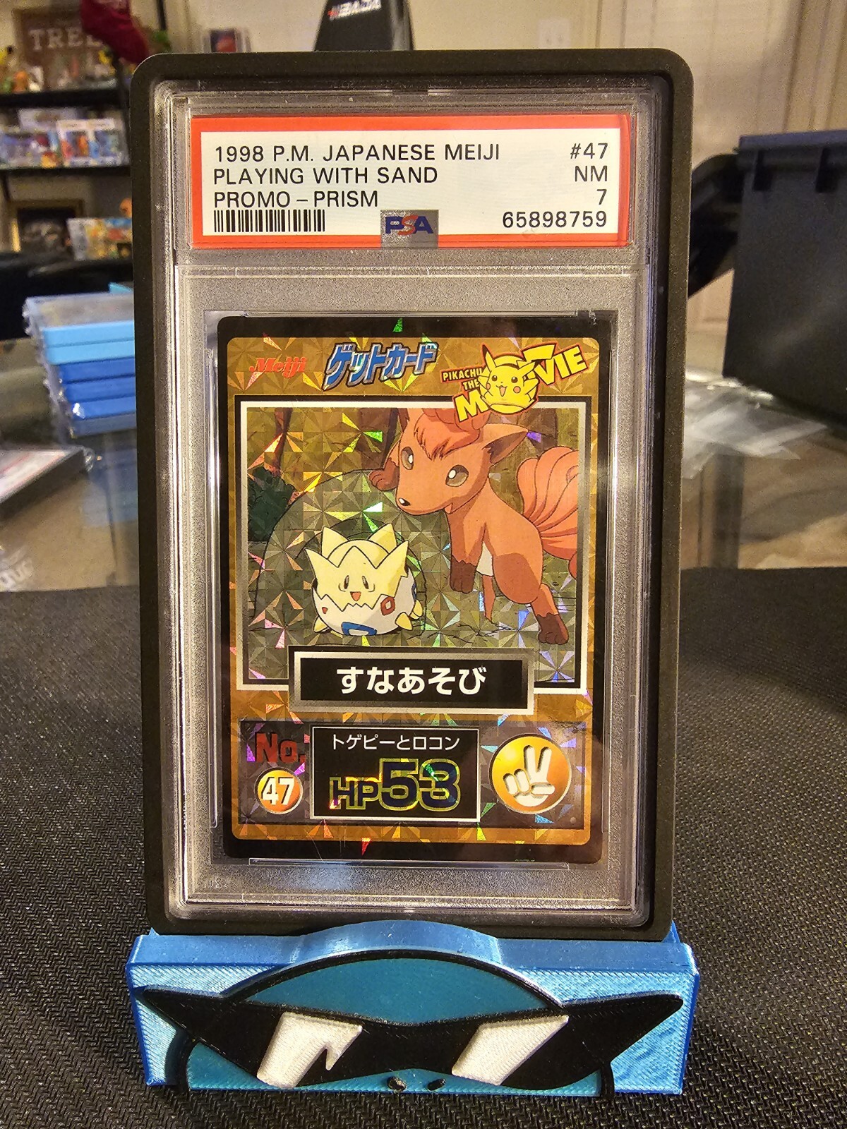 PSA 7 Pokemon Meiji The Movie Promo Togepi & Vulpix Playing With Sand #47 1998