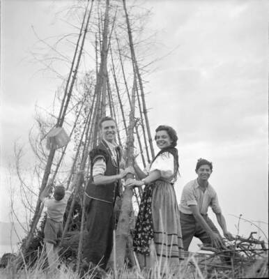 Rutli National holiday celebration young people stacking up firewo- Old Photo