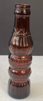 UNCLE JO Vintage Art Deco Soda POP Bottle Brown Amber 4 oz. 7 inches tall.