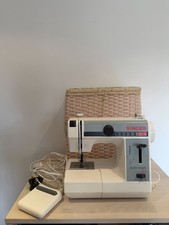 Singer Model 324 Featherweight Sewing Machine with basket