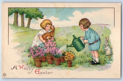 c1910's Easter Children Watering Can Plants Bunnies Rabbit Antique Postcard