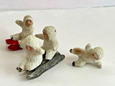 (4)  ANTIQUE German SNOW BABY Figurines - One on Sled + Tin Sled Early 1900's