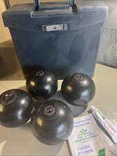 Henselite Super-Grip bowls (Size 5), a carrying case, Grippo polish, rule book.